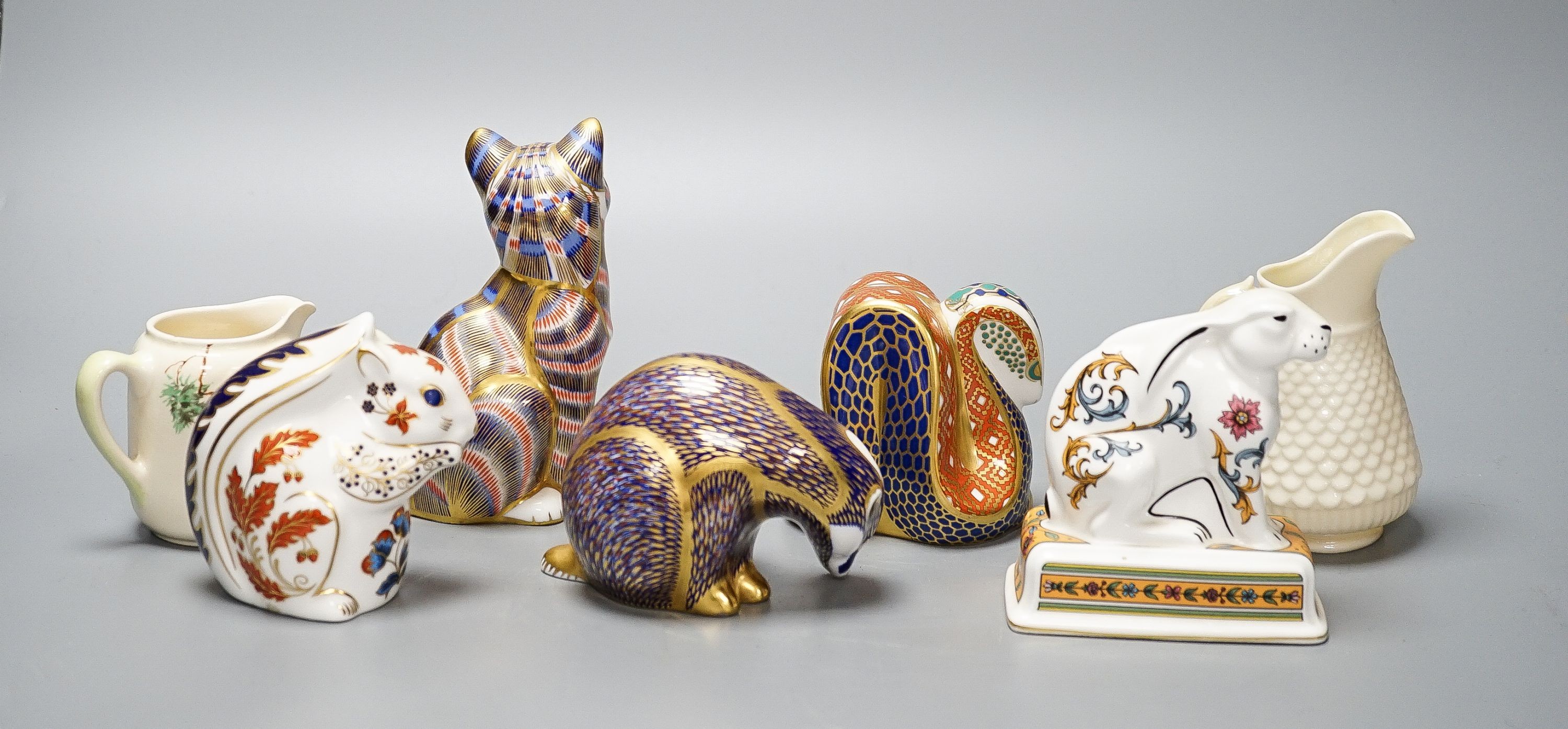 Four Royal Crown Derby paperweights, a Royal Doulton jug, a Belleek jug and a Wedgwood Noah’s ark collection hare